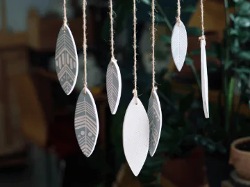 Handmade hanging wind chime made from rope and clay