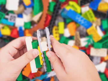 Child playing with lego