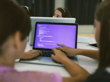 Children on computers coding