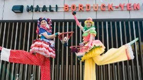 Two clowns on stilts at the reopening party for Swan Active Midland