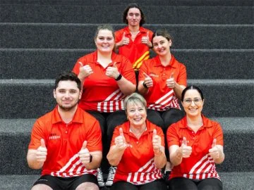 Swan Active team members sitting on stairs