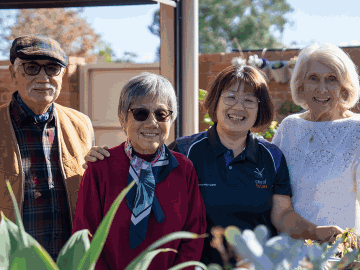 Laughing seniors at Swan Caring with a City worker