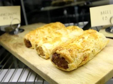 Sausage rolls in a display counter at a cafe