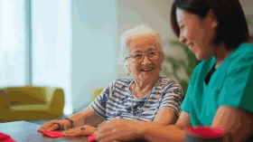 Lady helping a senior man