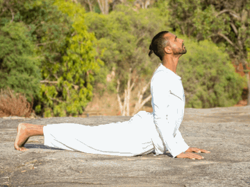 Priesh Devji practicing yoga outdoors