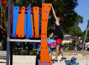 Child climbing on play equipment