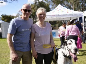 City of Swan community members with their dog at a park.