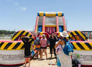 Tanya Richardson, City of Swan Mayor and community members enjoy the waterslides