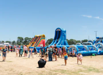 Crowds flock to the waterslides at Ellenbrook Inflatable Day